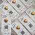 Heart-shaped chocolates on wedding invitation cards with QR codes for photo sharing.