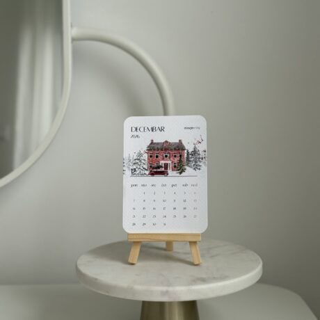 Elegant December wall calendar on minimalist wooden display stand. Perfect for modern interior decor.