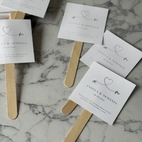 Elegant wedding favor tags with minimalist design, featuring hearts and personalized text.