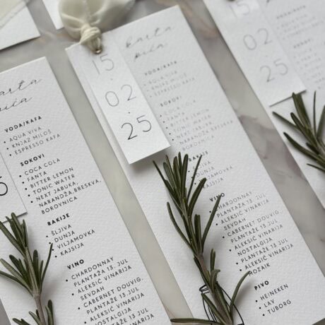 Elegant wedding menu cards with fresh rosemary sprigs for sophisticated event styling.