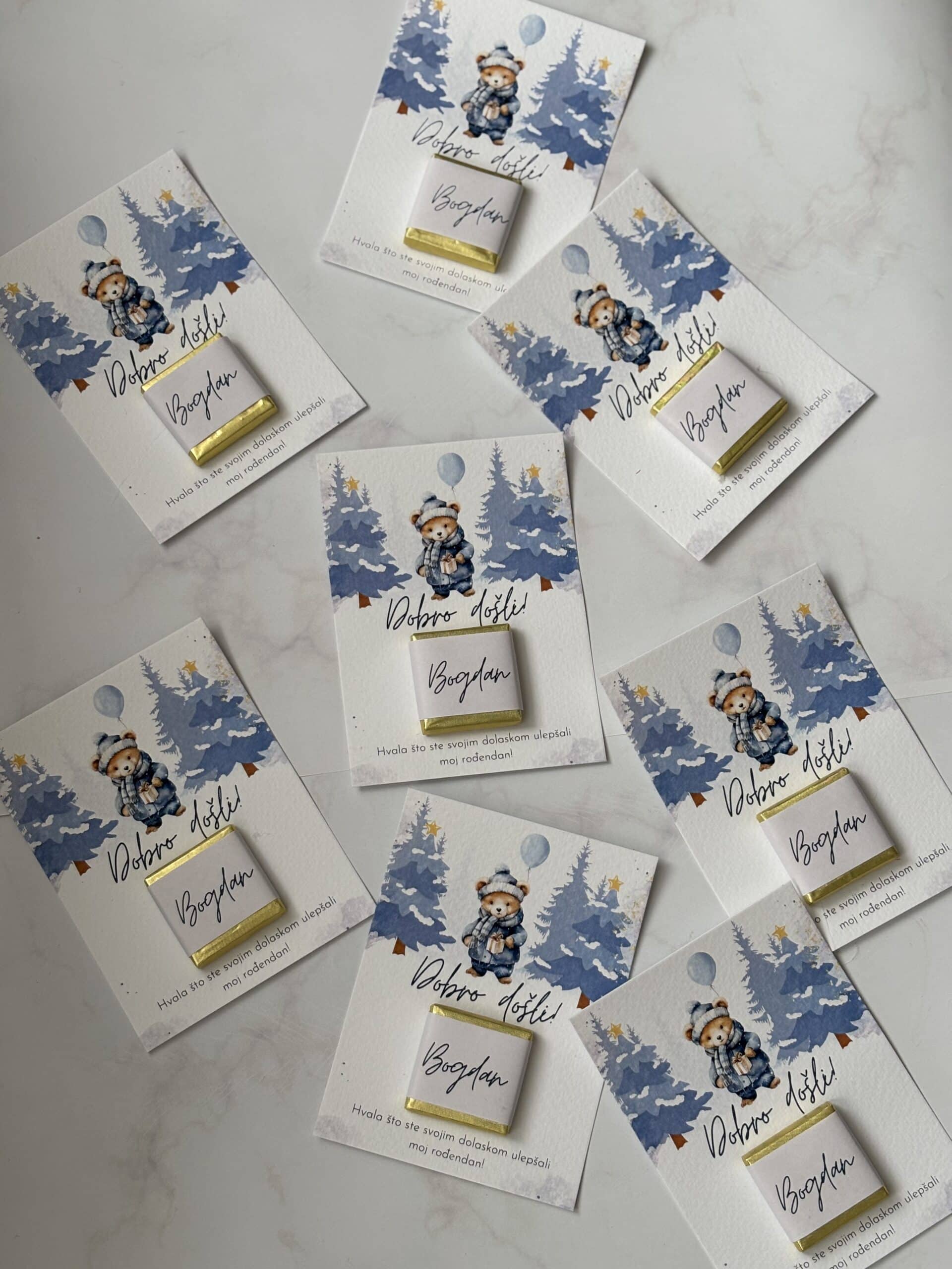 Festive greeting cards with teddy bear design and personalized name tags for Christmas.