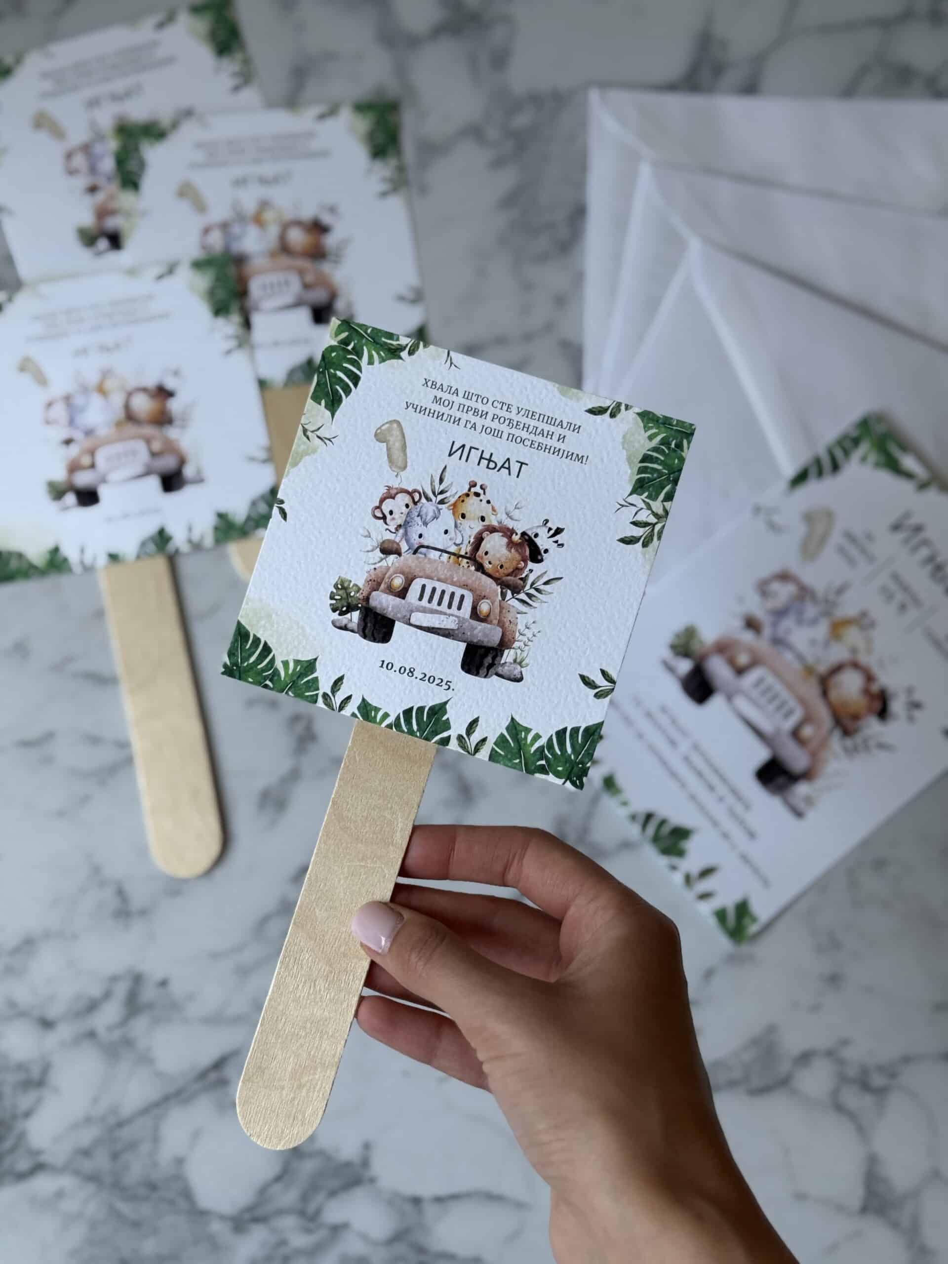 Cute jungle-themed first birthday party favor with animal illustrations and wooden sticks.